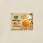 Box of Sempio Organic Tartary Buckwheat Tea with a cup of amber tea and plant motifs on a beige carton.