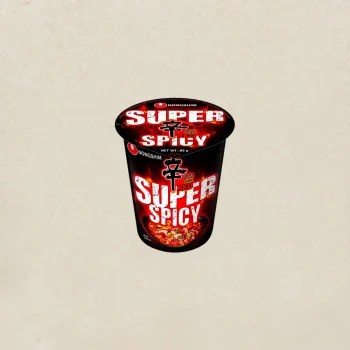 Nongshim Super Spicy instant noodle cup with black and fiery red packaging (front view).