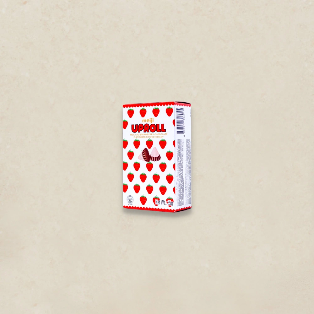메이지 초코룸스 딸기 Meiji UpRoll strawberry chocolate box with a red strawberry print pattern on a light beige background.