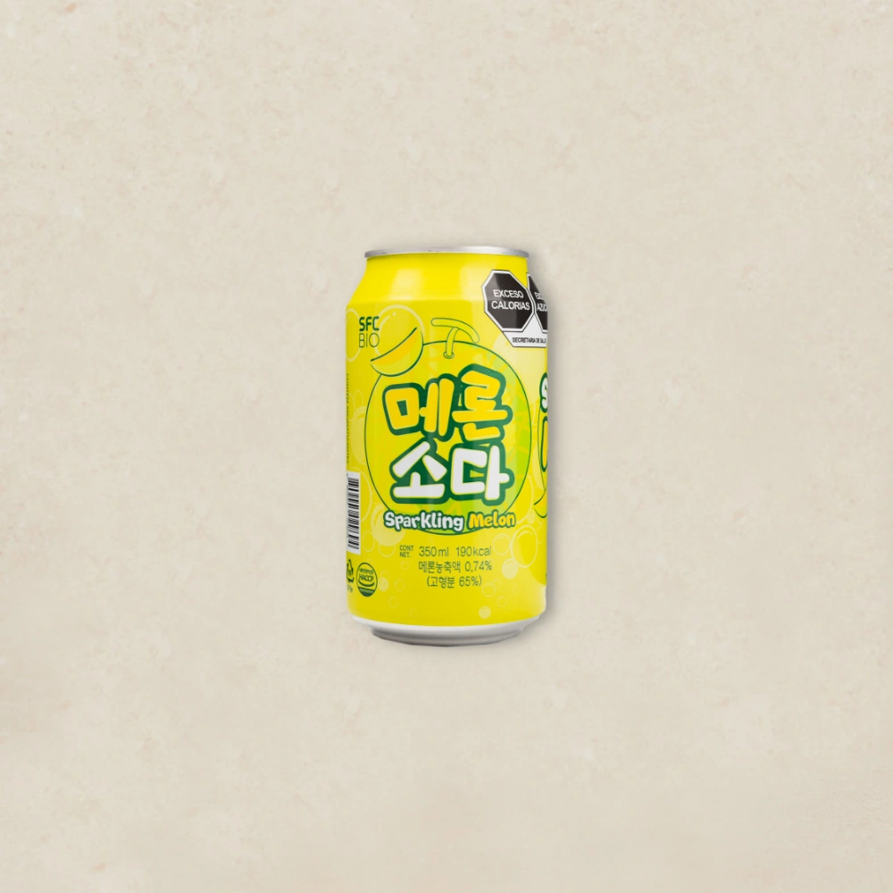 멜론 소다 Yellow can of Sparkling Melon beverage with Korean text, centered on a light beige background.