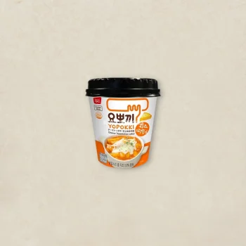 Cup of Yopokki Cheese Tteokbokki instant rice cake with cheese, black lid, orange-and-white packaging on a beige background.