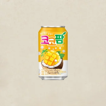 Can of Korean mango-coconut drink with a tropical mango image on a yellow label, set against a beige background.