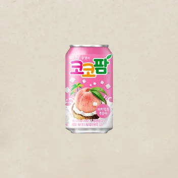 Pink can of Korean peach-flavored soft drink with peaches and ice cubes on the label, set against a light pink background.