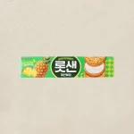 Green Lotte pineapple cream sandwich cookies box with pineapple graphic and stacked biscuits on the right.
