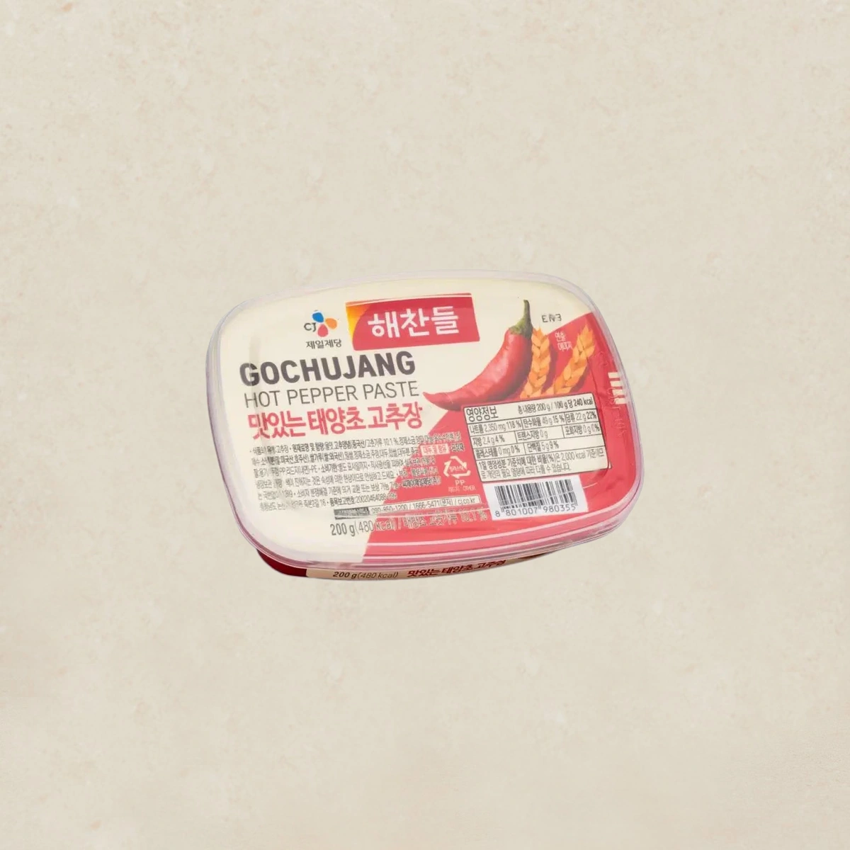 CJ HEACHANDLE Red Pepper Paste 태양초고추장 200g Container of gochujang hot pepper paste with Korean packaging and red label reading 'GOCHUJANG' on a light background