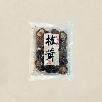 Bag of dried mushrooms in a clear plastic package with a white label and bold black Japanese characters on the front.