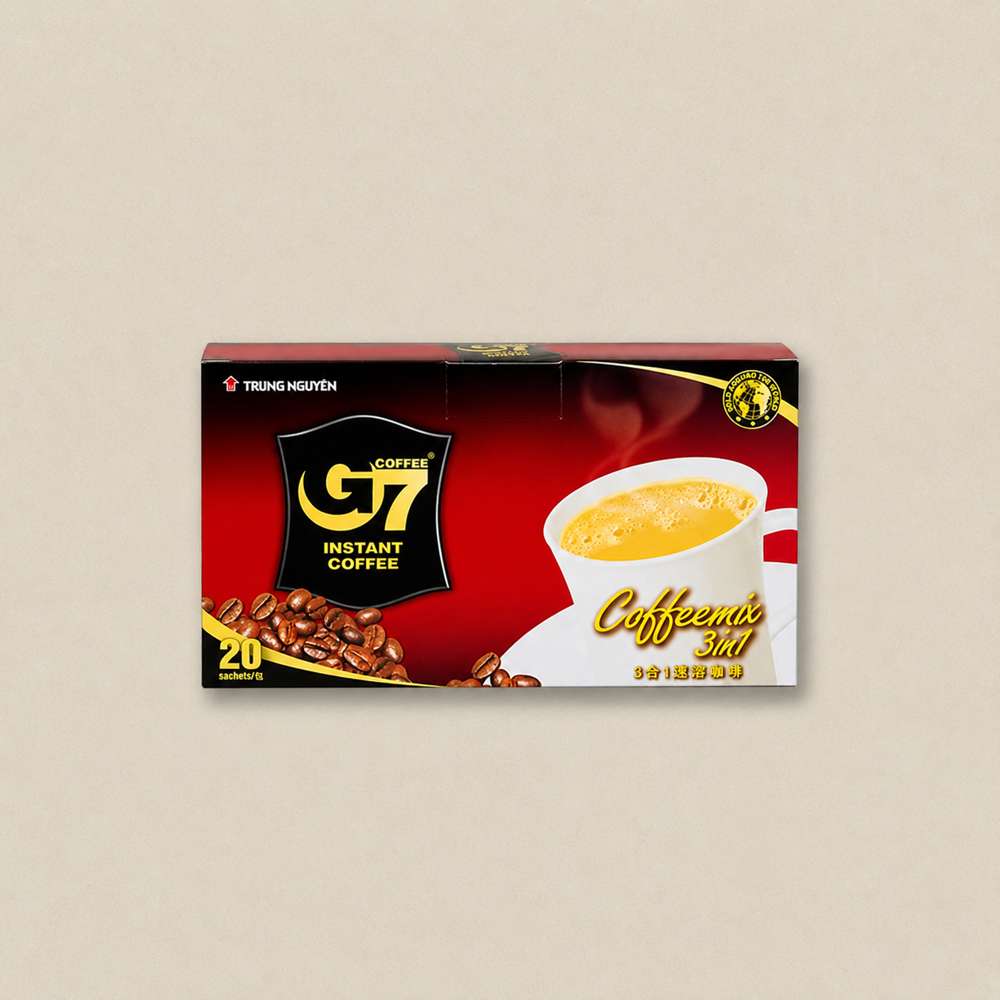 g7 3인 Box of G7 instant coffee mix with a cup of coffee on the packaging, red and black design, 20 sachets included