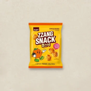 Bright yellow bag of ZZANG SNACK Korean crackers with a cartoon mascot on the front.