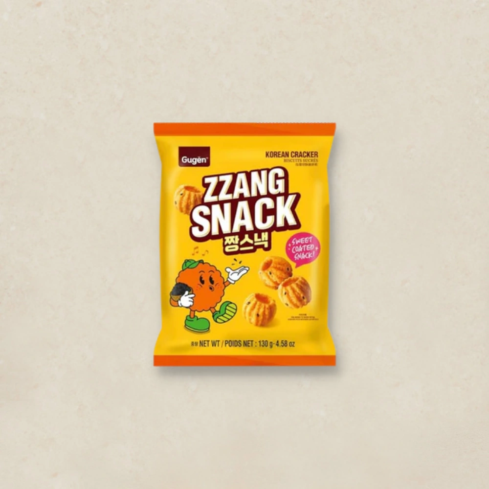 구겐 짱스낵 Bright yellow bag of ZZANG SNACK Korean crackers with a cartoon mascot on the front.