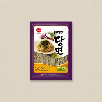 Purple Nongshim glass noodle package featuring a plated noodle dish on the front label.