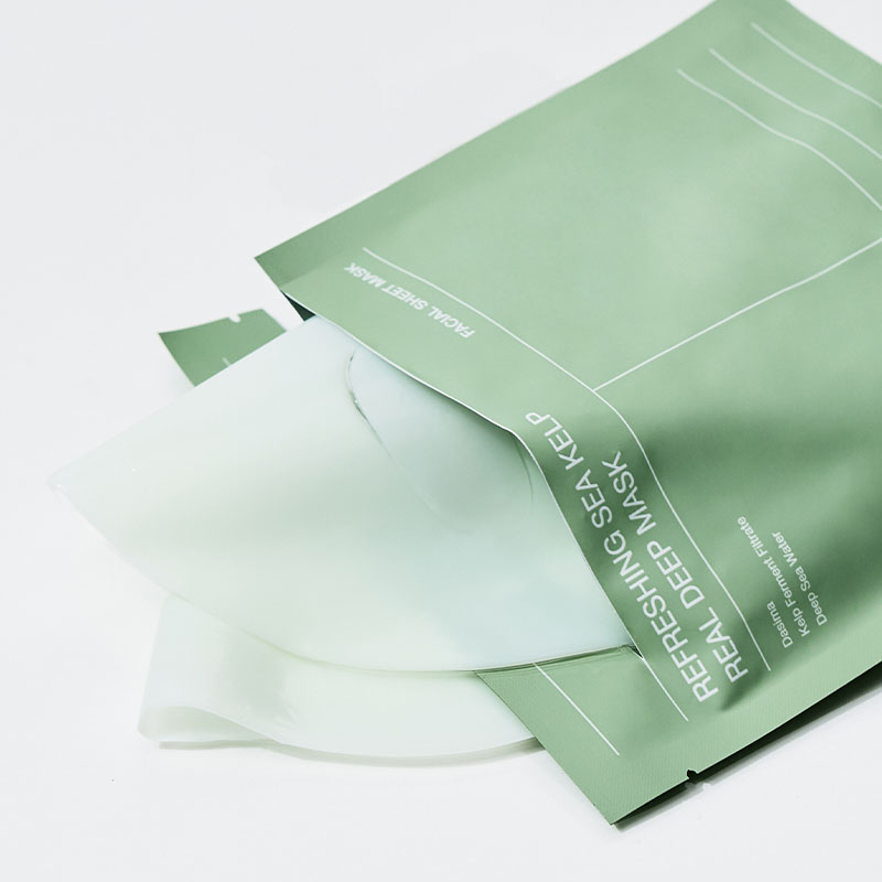 바이오던스 마스크 초록 Green facial mask packaging opened to reveal a translucent sheet mask ready for use in a skincare routine
