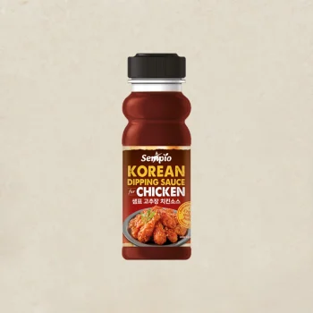 Bottle of Sempio Korean dipping sauce for chicken, with fried chicken pictured on the label plate