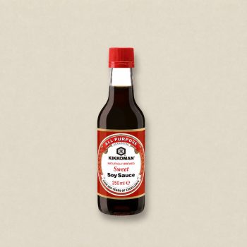 Kikkoman all-purpose Sweet Soy Sauce bottle with red cap on a neutral background (250 ml).