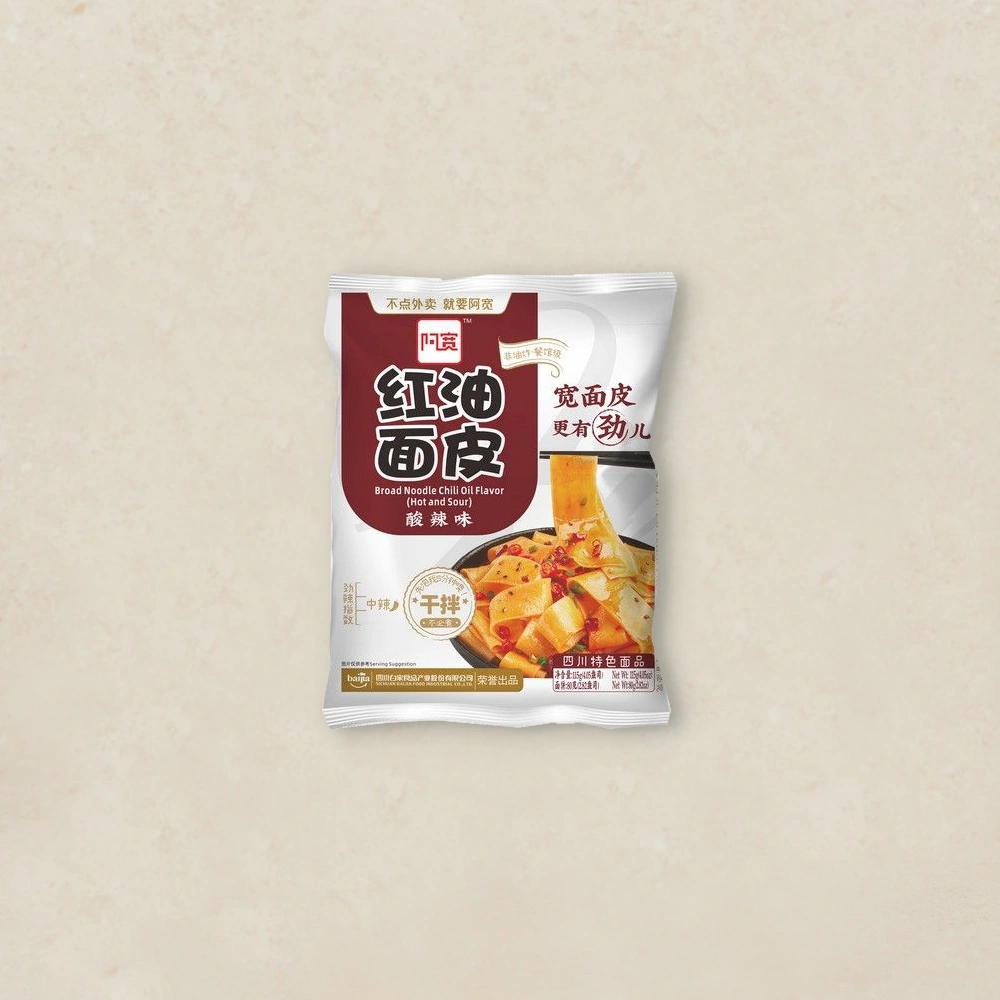 홍유면피 매콤새콤 Front of a snack bag labeled Broad Noodle Chili Oil Flavor with an image of noodles in a bowl on the front.