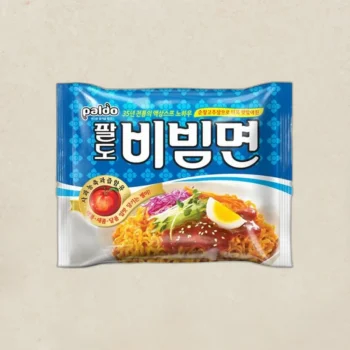 Paldo Bibimmyeon instant noodles package in blue with a bowl of spicy noodles topped with egg and veggies.