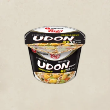 Cup of Nongshim Udon Tempura Noodle Soup, black-labeled container viewed from above.