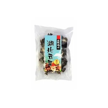 Clear plastic bag containing dried black fungus (wood ear mushrooms) with a turquoise label featuring Chinese characters and a small yellow badge at the bottom edge.