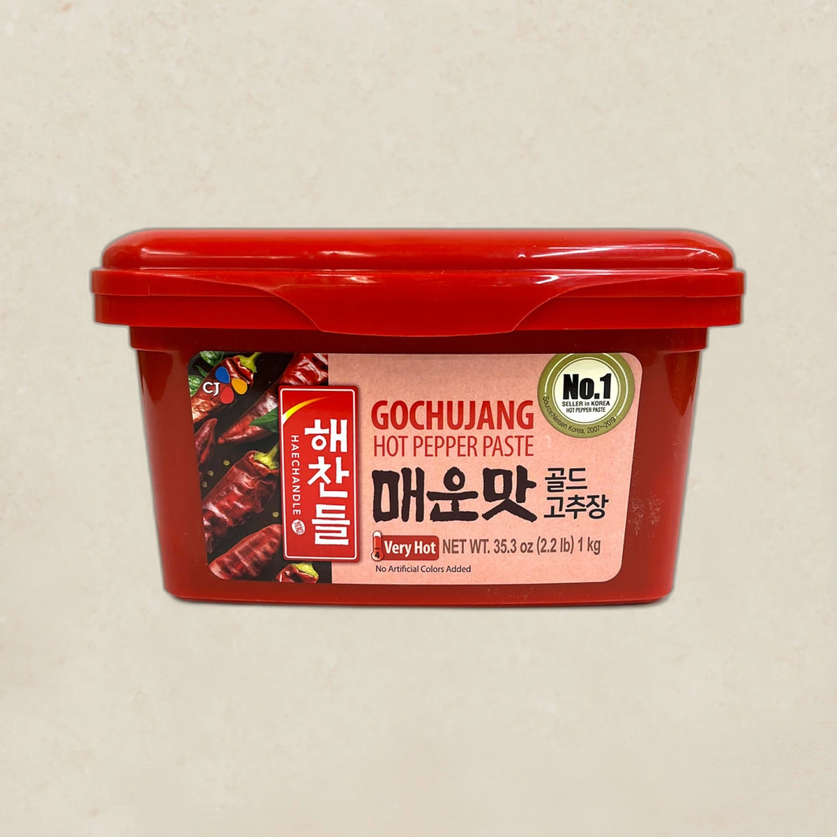 mall_ref1558_1787137372.webp Red tub of Gochujang hot pepper paste with a pink label and 'Very Hot' indicator on the front.