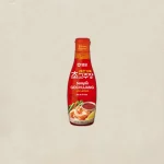 Bottle of Sempio Gochujang chili paste with lemon, red label, displayed against a light background