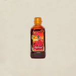 Bottle of Korean chili sauce with an orange cap, centered on a beige background.